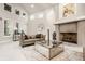 Spacious living room with high ceilings, a large fireplace, and ample natural light at 9468 Sullivan Pl, Zionsville, IN 46077