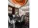 Elegant dining room features a large table, modern chairs, and a statement chandelier at 9468 Sullivan Pl, Zionsville, IN 46077