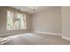 Spacious bedroom with large window and neutral wall colors at 9468 Sullivan Pl, Zionsville, IN 46077