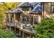 Brick house exterior with a large deck and beautiful landscaping at 9468 Sullivan Pl, Zionsville, IN 46077