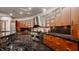 Modern kitchen with curved cabinetry, stainless steel appliances, and granite countertops at 9468 Sullivan Pl, Zionsville, IN 46077