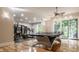 Finished basement features a home gym and ping pong table at 9468 Sullivan Pl, Zionsville, IN 46077