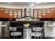 Mid-century modern kitchen with stainless steel appliances and a breakfast nook at 9468 Sullivan Pl, Zionsville, IN 46077