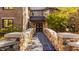 Brick home with stone bridge and walkway leading to a grand entrance at 9468 Sullivan Pl, Zionsville, IN 46077