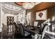 Elegant dining room with large windows and a formal table setting at 9468 Sullivan Pl, Zionsville, IN 46077