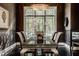 Elegant dining room with large windows and a formal table setting at 9468 Sullivan Pl, Zionsville, IN 46077