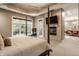 Spacious main bedroom with a large bed, fireplace, and access to a private balcony at 9468 Sullivan Pl, Zionsville, IN 46077