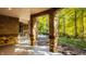 Covered patio area with a view of the wooded backyard at 9468 Sullivan Pl, Zionsville, IN 46077