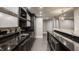 Finished basement with a stylish bar, granite countertops, and modern appliances at 9468 Sullivan Pl, Zionsville, IN 46077