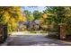 Gated entrance to a large brick house with a circular driveway at 9468 Sullivan Pl, Zionsville, IN 46077