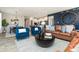 Living room with leather sofas and blue armchairs at 18425 Depoe Ln, Westfield, IN 46074