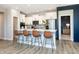 Modern kitchen with white cabinets, quartz countertops and island seating at 18425 Depoe Ln, Westfield, IN 46074