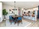 Bright dining room with a wood table and blue chairs at 18425 Depoe Ln, Westfield, IN 46074