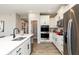 Modern kitchen with stainless steel appliances and white cabinetry at 18425 Depoe Ln, Westfield, IN 46074