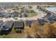Aerial view of community with homes and a pond at 1224 Gunnison Dr, Greenfield, IN 46140