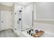 Modern bathroom with glass shower, soaking tub, and patterned floor at 12594 Tidecrest Dr, Fishers, IN 46037