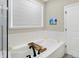 Relaxing bathroom with soaking tub, subway tile, and window at 12594 Tidecrest Dr, Fishers, IN 46037