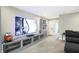 Bonus room entertainment area with large TV and media console at 12594 Tidecrest Dr, Fishers, IN 46037
