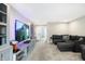 Spacious bonus room with sectional sofa and large TV at 12594 Tidecrest Dr, Fishers, IN 46037