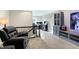 Bonus room with a recliner, media cabinet, and home office at 12594 Tidecrest Dr, Fishers, IN 46037