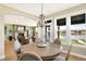 Breakfast nook with view of a pond and fireplace at 12594 Tidecrest Dr, Fishers, IN 46037