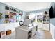 Home office with built-in shelves, desk, and a wall of records at 12594 Tidecrest Dr, Fishers, IN 46037