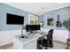 Stylish home office featuring a large desk, comfortable chair, and wall art at 12594 Tidecrest Dr, Fishers, IN 46037