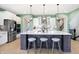 Stunning kitchen featuring a large island, modern appliances, and stylish lighting at 12594 Tidecrest Dr, Fishers, IN 46037