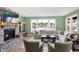 Comfortable living room boasts a fireplace, large windows, and ample natural light at 12594 Tidecrest Dr, Fishers, IN 46037