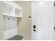 Functional mudroom with bench, cubbies, and hooks at 12594 Tidecrest Dr, Fishers, IN 46037
