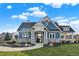 Charming pool house with stone accents and covered porch at 12594 Tidecrest Dr, Fishers, IN 46037