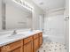 Bathroom with double vanity and shower/tub combo at 6832 Harriet Dr, Indianapolis, IN 46237