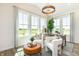 Sunlit office features a workspace with two chairs and a view of the backyard at 413 Onset Way, Westfield, IN 46074
