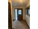Home entryway with brown door and decorative mirror at 589 N Sunset Ct, Greenfield, IN 46140