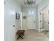 Bright and airy entryway with white door and wood flooring at 1939 Ponsonby Dr, Westfield, IN 46074