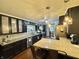 Modern kitchen with dark cabinets, granite countertops, and stainless steel appliances at 74 Morgan St, Danville, IN 46122