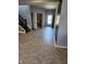 Bright entryway with wood-look floors and staircase at 428 N Wyndstone Way, Fortville, IN 46040