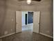 Simple bedroom with double doors and gray walls at 428 N Wyndstone Way, Fortville, IN 46040