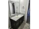 Bathroom with vanity, sink, and dark brown cabinets at 428 N Wyndstone Way, Fortville, IN 46040