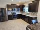 Modern kitchen featuring stainless steel appliances at 428 N Wyndstone Way, Fortville, IN 46040
