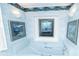 Bathroom with light blue tile, a bathtub, and framed artwork at 2212 Larita Ln, Anderson, IN 46017