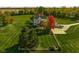 Aerial view of a farmhouse with beautiful fall colors at 10510 N County Road 650 E, Brownsburg, IN 46112