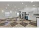 Modern kitchen with stainless steel appliances and checkered floor at 1208 W 18Th St, Indianapolis, IN 46202