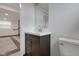 Basement bathroom with dark vanity and toilet, modern fixtures at 1208 W 18Th St, Indianapolis, IN 46202
