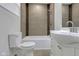 Clean bathroom with white vanity, tub and tile shower at 1208 W 18Th St, Indianapolis, IN 46202