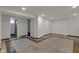 Finished basement features tile and carpet flooring, a bathroom, and ample storage at 1208 W 18Th St, Indianapolis, IN 46202