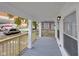 Charming front porch features a gray deck and wooden railing at 1208 W 18Th St, Indianapolis, IN 46202