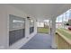 Side porch with gray decking and exterior lighting at 1208 W 18Th St, Indianapolis, IN 46202