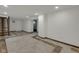 Finished basement with tile flooring, an open layout, and a modern staircase at 1208 W 18Th St, Indianapolis, IN 46202