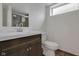 Basement bathroom with dark vanity, toilet, and tiled flooring at 1208 W 18Th St, Indianapolis, IN 46202